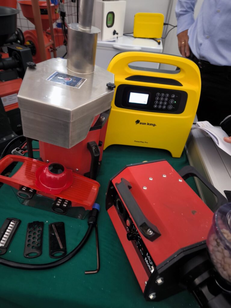 A mill and a coffee grinder. Examples of productive uses of solar electricity. These units were compatible with a Sun King battery hub (a major manufacturer in the sector).